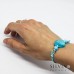 Bracciale cordino cerato con conchiglia azzurra